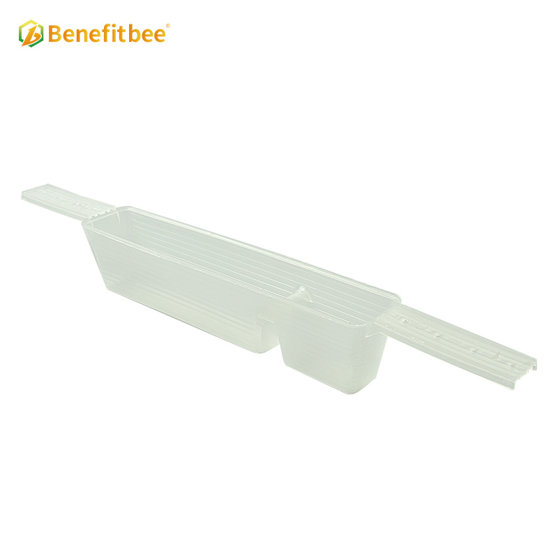 Beehive inside plastic bee feeder for beekeeping